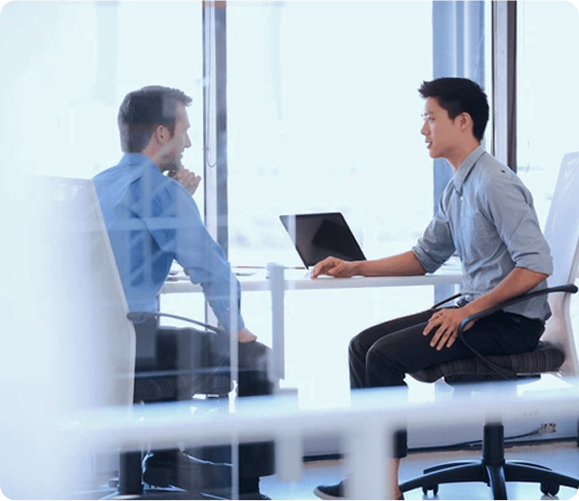 Two men in a professional meeting setting
